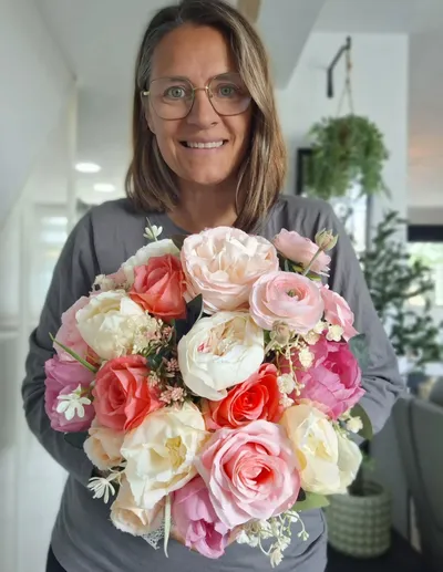 Anita with a floral arrangement