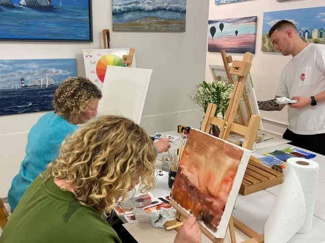 Painting materials laid out at an art class beside the sea in Lee-on-the-Solent